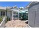 Charming home with a brick patio and outdoor seating under a blue umbrella, perfect for relaxing at 3423 52Nd Avenue W Cir # 267, Bradenton, FL 34210