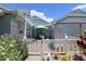 Inviting fenced-in front yard with lovely garden and outdoor seating under the bright blue sky at 3423 52Nd Avenue W Cir # 267, Bradenton, FL 34210
