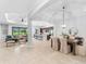 Open concept dining room with a view of the kitchen and living room at 25081 Spartina Dr, Venice, FL 34293