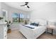 Spacious bedroom with large windows and white bed at 25081 Spartina Dr, Venice, FL 34293