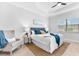 Main bedroom with a king bed and sitting area at 25081 Spartina Dr, Venice, FL 34293