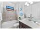 Clean bathroom with a bathtub and modern vanity at 25081 Spartina Dr, Venice, FL 34293