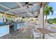 Outdoor pool bar with seating and a view of the pool at 25081 Spartina Dr, Venice, FL 34293