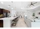 Open concept kitchen with island, stainless steel appliances, and views to living area at 25081 Spartina Dr, Venice, FL 34293