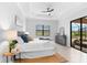 Main bedroom with access to the backyard patio at 25081 Spartina Dr, Venice, FL 34293