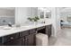 Elegant bathroom with double vanity and a large mirror at 25081 Spartina Dr, Venice, FL 34293