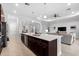 Open concept kitchen with island and breakfast bar, stainless steel appliances at 25081 Spartina Dr, Venice, FL 34293