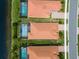 Aerial view of three homes with pools at 25081 Spartina Dr, Venice, FL 34293