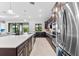 Modern kitchen with stainless steel appliances and a large island at 25081 Spartina Dr, Venice, FL 34293