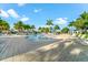 Expansive pool area with multiple lounge chairs and a pool at 25081 Spartina Dr, Venice, FL 34293