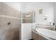 Clean bathroom with a walk-in shower and soaking tub at 25081 Spartina Dr, Venice, FL 34293