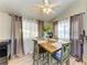 Charming dining area with a rustic wooden table and four chairs at 4921 Pebble Beach Ave, Sarasota, FL 34234