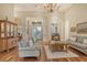 Bright living room with hardwood floors, comfortable seating and entryway view at 811 Riviera Dunes Way, Palmetto, FL 34221