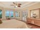 Main bedroom with water views and sitting area at 811 Riviera Dunes Way, Palmetto, FL 34221