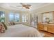 Main bedroom with water views and sitting area at 811 Riviera Dunes Way, Palmetto, FL 34221