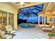 Relaxing pool and spa area with lounge chairs and water views at 811 Riviera Dunes Way, Palmetto, FL 34221