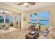 Relaxing sitting room with access to outdoor patio and water views at 811 Riviera Dunes Way, Palmetto, FL 34221