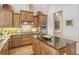 Gourmet kitchen with granite countertops, custom cabinetry, and high-end appliances at 811 Riviera Dunes Way, Palmetto, FL 34221
