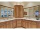 Elegant bathroom with double vanities, a corner cabinet, and large mirrors at 811 Riviera Dunes Way, Palmetto, FL 34221