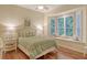 Charming bedroom with bay window and built-in window seat at 811 Riviera Dunes Way, Palmetto, FL 34221