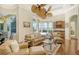 Gathering room with hardwood floors, comfortable seating, and water views at 811 Riviera Dunes Way, Palmetto, FL 34221