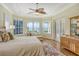 Main bedroom with water views and sitting area at 811 Riviera Dunes Way, Palmetto, FL 34221