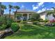 Well maintained home with a two-car garage and lush landscaping at 811 Riviera Dunes Way, Palmetto, FL 34221