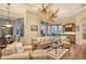 Spacious living room with hardwood floors, neutral tones, and access to a relaxing patio at 811 Riviera Dunes Way, Palmetto, FL 34221