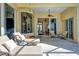 Relaxing patio with lounge chairs, offering views of the interior at 811 Riviera Dunes Way, Palmetto, FL 34221