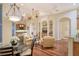 Gathering room with hardwood floors, light walls, and a view of the water at 811 Riviera Dunes Way, Palmetto, FL 34221