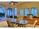 Outdoor kitchen with dining area and stunning water views at 811 Riviera Dunes Way, Palmetto, FL 34221