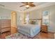 Spacious bedroom with hardwood floors and ceiling fan at 811 Riviera Dunes Way, Palmetto, FL 34221