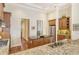Kitchen boasts granite countertops, stainless steel appliances, and ample wood cabinetry at 811 Riviera Dunes Way, Palmetto, FL 34221