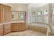 Bathroom with soaking tub and large vanity at 811 Riviera Dunes Way, Palmetto, FL 34221