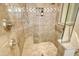 Large walk-in shower with a built-in seat and grab bar at 811 Riviera Dunes Way, Palmetto, FL 34221