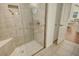 Spacious shower with built-in seat and glass enclosure at 811 Riviera Dunes Way, Palmetto, FL 34221