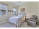 Cozy guest bedroom with a comfortable bed and sitting area at 5145 96Th E St, Bradenton, FL 34211