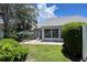 Private backyard with patio, lush landscaping, and screened enclosure at 3423 52Nd Avenue W Cir # 267, Bradenton, FL 34210