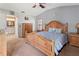 Spacious main bedroom with a large bed, dresser, and private bathroom access at 3423 52Nd Avenue W Cir # 267, Bradenton, FL 34210