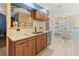 Updated kitchen with wood cabinets, granite counters, and stainless steel appliances at 3423 52Nd Avenue W Cir # 267, Bradenton, FL 34210