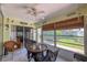 Peaceful sunroom with wicker furniture and view of the backyard at 3423 52Nd Avenue W Cir # 267, Bradenton, FL 34210