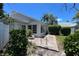Private backyard oasis with a patio, lush landscaping, and a screened enclosure at 3423 52Nd Avenue W Cir # 267, Bradenton, FL 34210