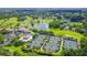 Aerial view of luxury community with golf course, tennis courts, and clubhouse at 360 N Point Rd, Osprey, FL 34229