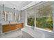 Spa-like bathroom with soaking tub, double vanity and large window at 360 N Point Rd, Osprey, FL 34229