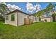Back exterior of house showing the pool and outdoor shower at 360 N Point Rd, Osprey, FL 34229