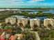 Aerial of luxury condos with water views and private villas at 360 N Point Rd, Osprey, FL 34229