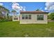 Spanish style home with red tile roof, multiple windows, and a manicured lawn at 360 N Point Rd, Osprey, FL 34229