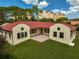 Two-story home with red tile roof and courtyard at 360 N Point Rd, Osprey, FL 34229