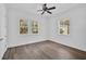 Bright bedroom with hardwood floors and large windows at 360 N Point Rd, Osprey, FL 34229