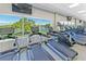 Modern fitness center with treadmills and cardio equipment overlooking a lake at 360 N Point Rd, Osprey, FL 34229